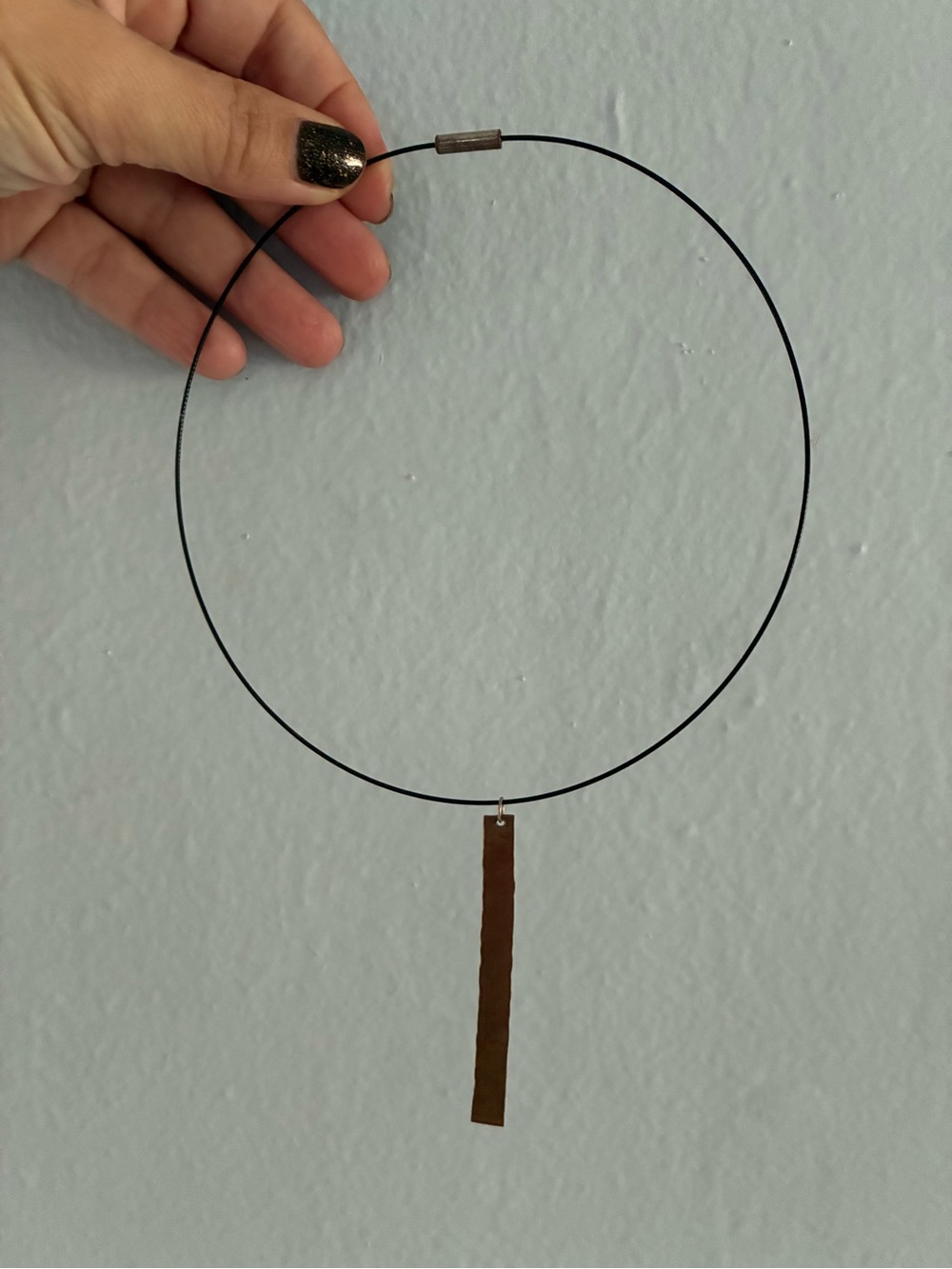 Minimalist Black Wire Hoop choker with pounded copper pendant
